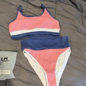 New color block swim suit. Large